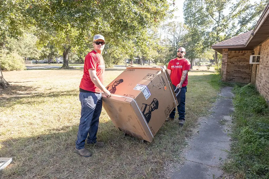 AC installation crew delivering new cooling unit in Orange TX